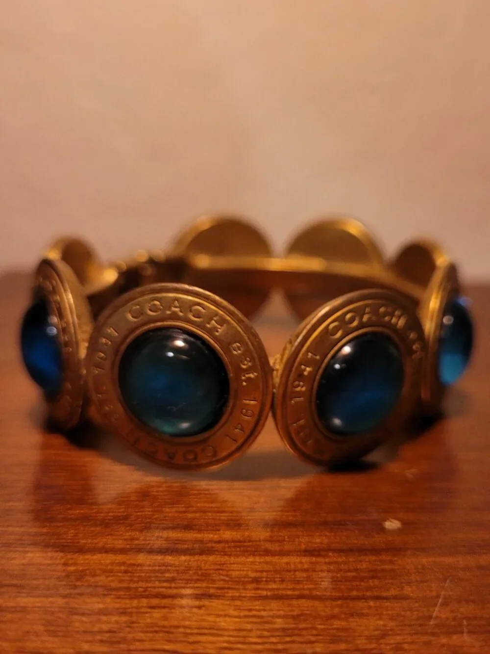 Coach Brass & Gemstone/Glass Cabochon Medallion Hinged Bangle Bracelet Blue